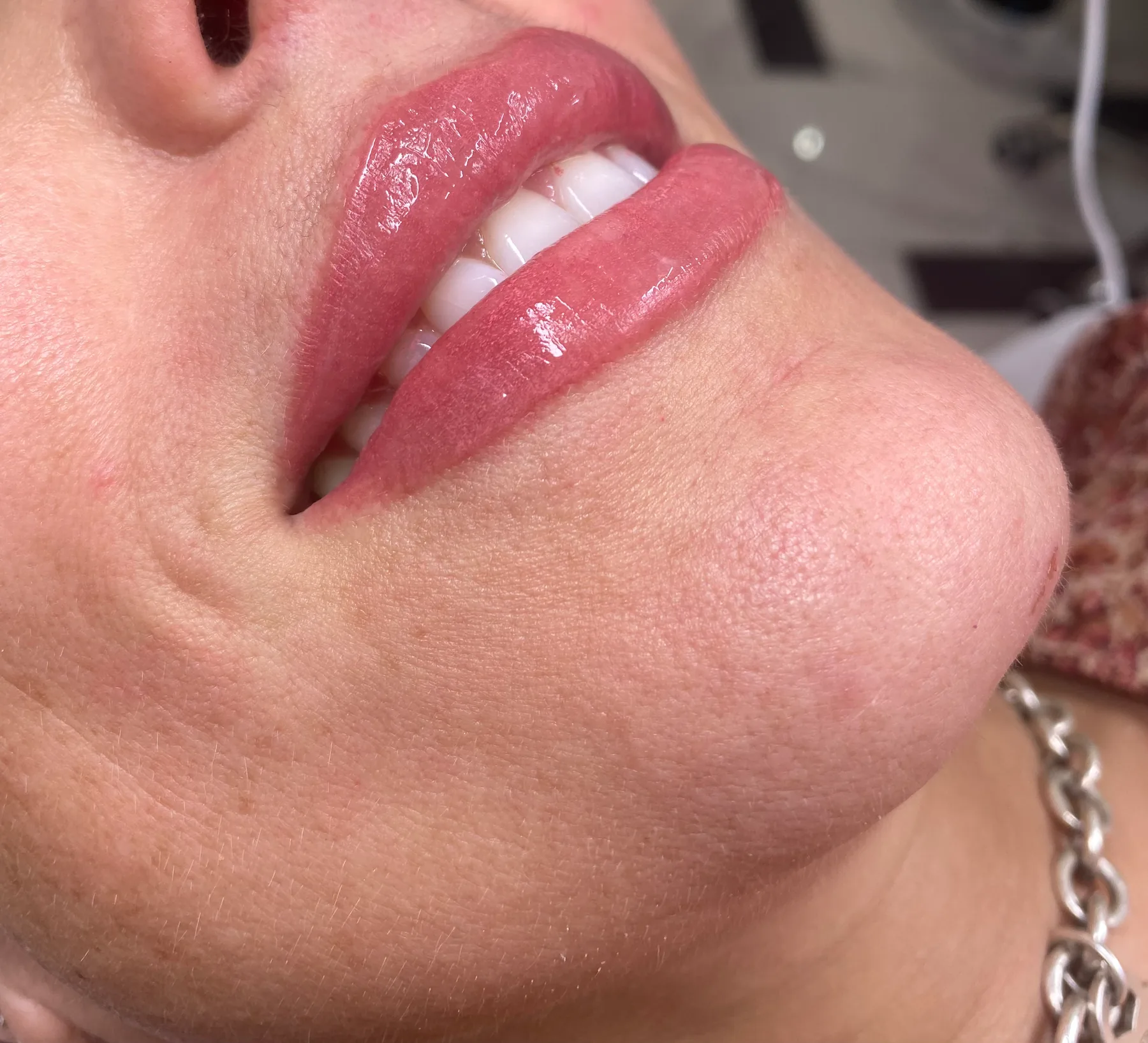 Close-up of lips after lip blushing, soft even rose tint
