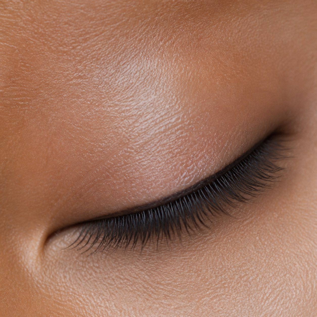 Macro detail of a closed eye and lash line