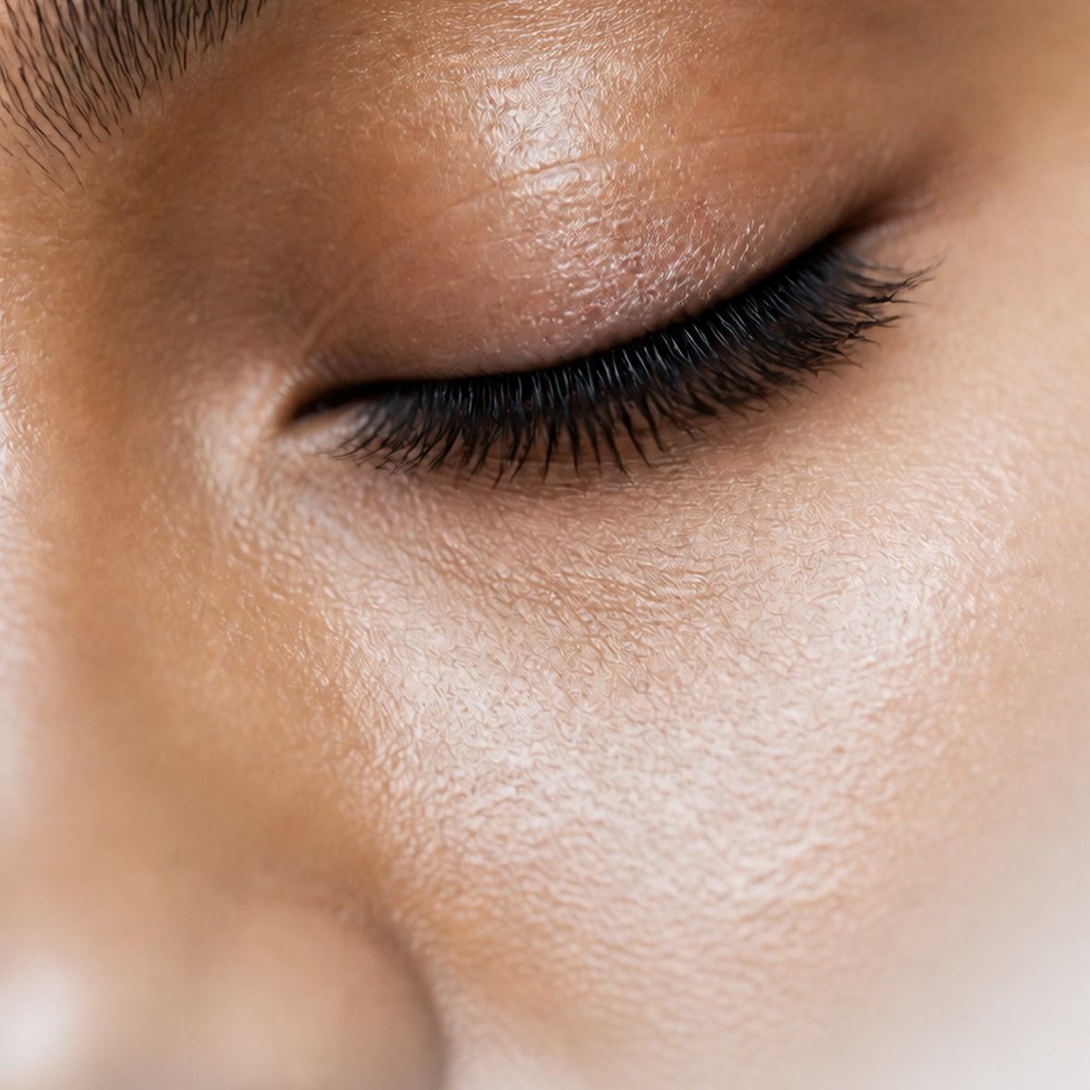 Macro detail of a closed eye and lash line